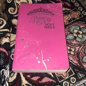 Princes Holy Bible used paper back cover page has a tear in front
